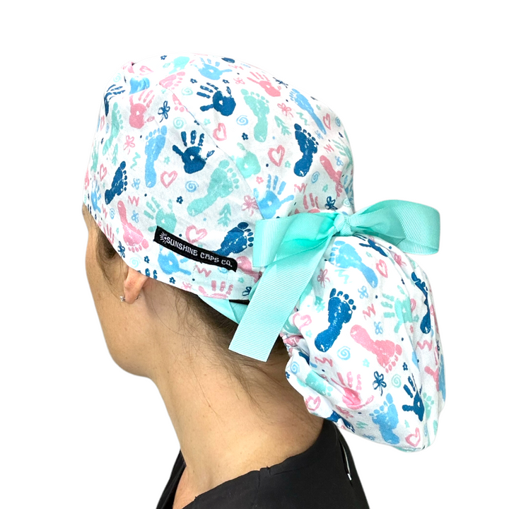 baby prints labor delivery Ponytail Scrub Cap for Women, By Sunshine Caps Co.