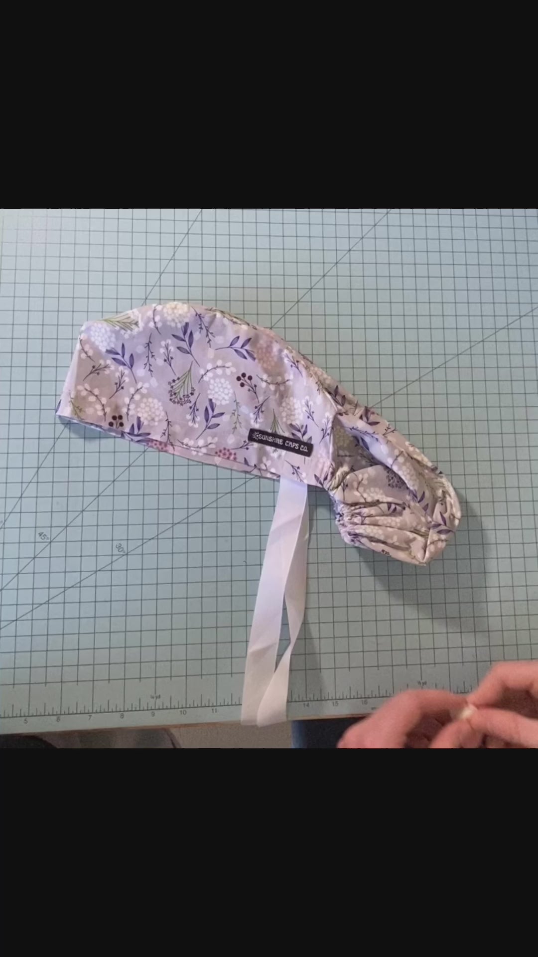 snap buttons for ear relief on scrub caps- demonstration video