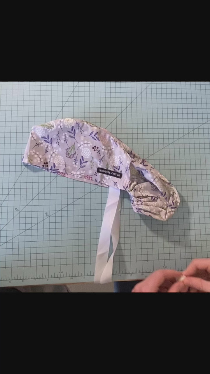 snap buttons for ear relief on scrub caps- demonstration video